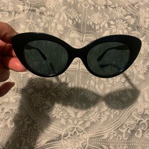 Dark sunglasses Cat Eye shape